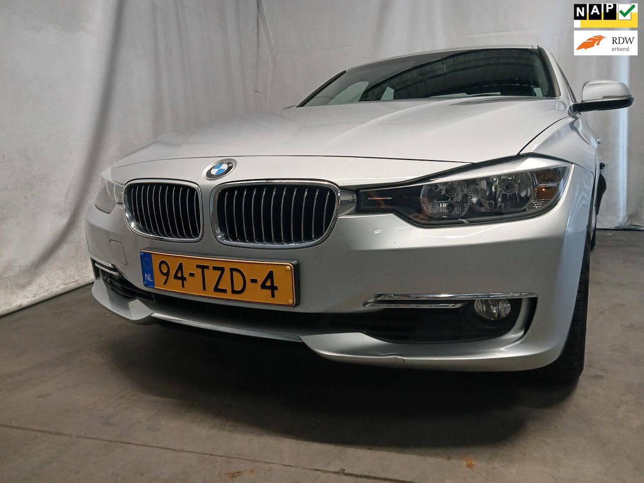 BMW 3-serie - 320i High Executive - Airco - Navi - Leer - Schade - AutoWereld.nl