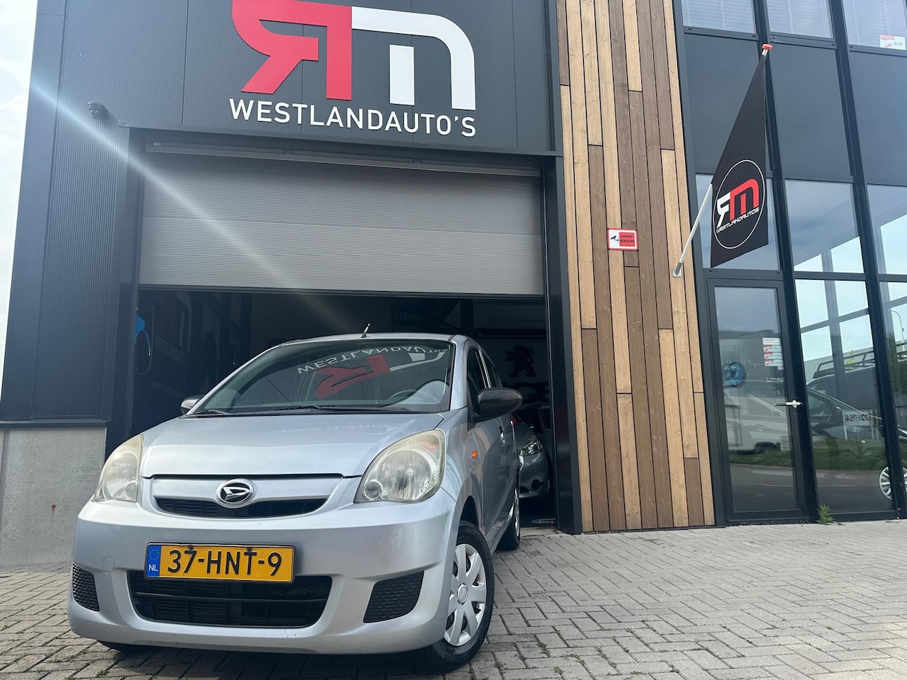 Daihatsu Cuore - 1.0 Trend/ dealer onderhouden/ 2 sleutels/ zeer zuinig - AutoWereld.nl