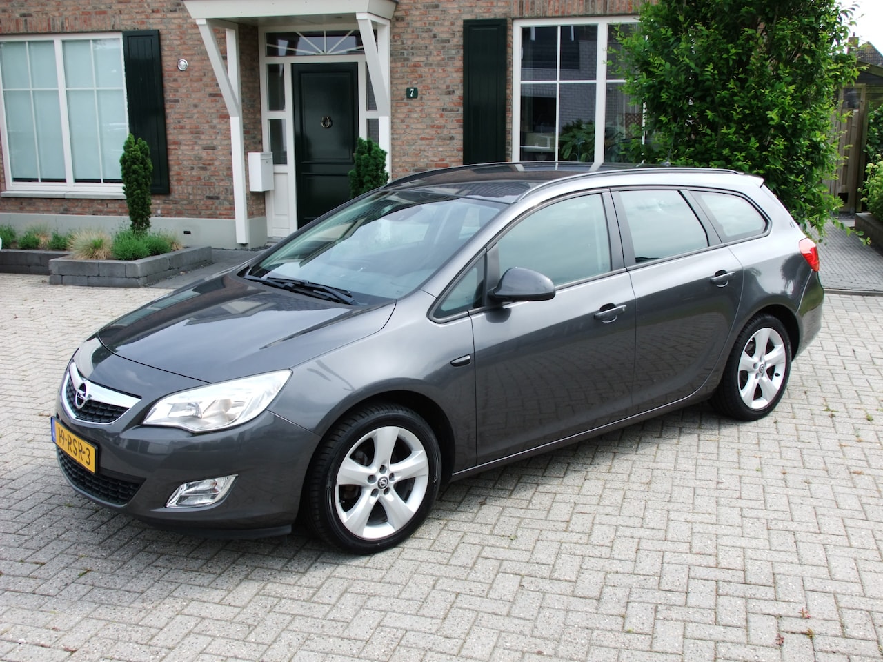 Opel Astra Sports Tourer - 1.4 Turbo Edition 1.4 Turbo Edition , Airco , Cruise , Trekhaak enz. - AutoWereld.nl