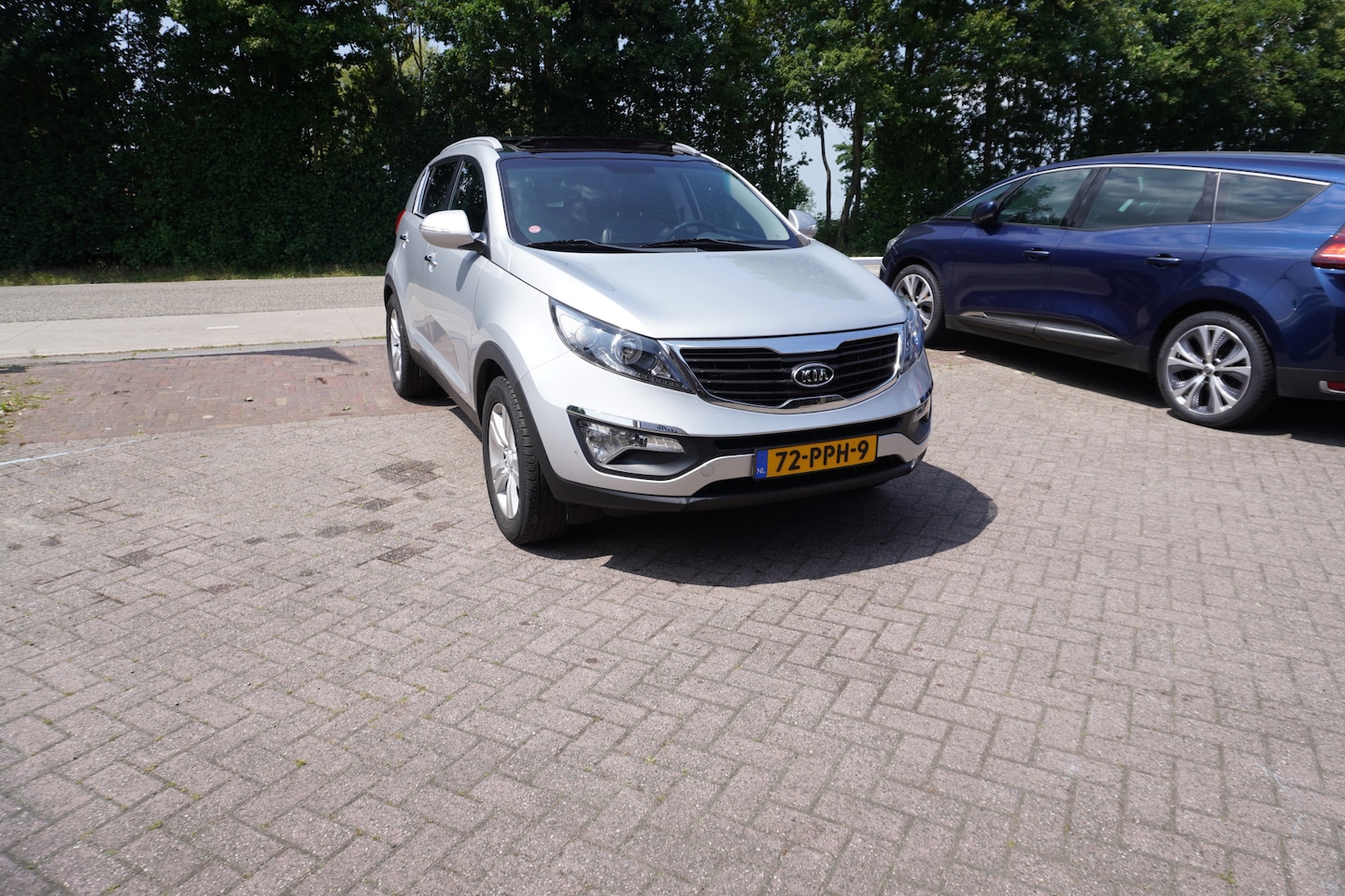 Kia Sportage - 2.0 X-ecutive Plus Pack TREKHAAK OPEN DAK CRUISE CLIMA PDC - AutoWereld.nl