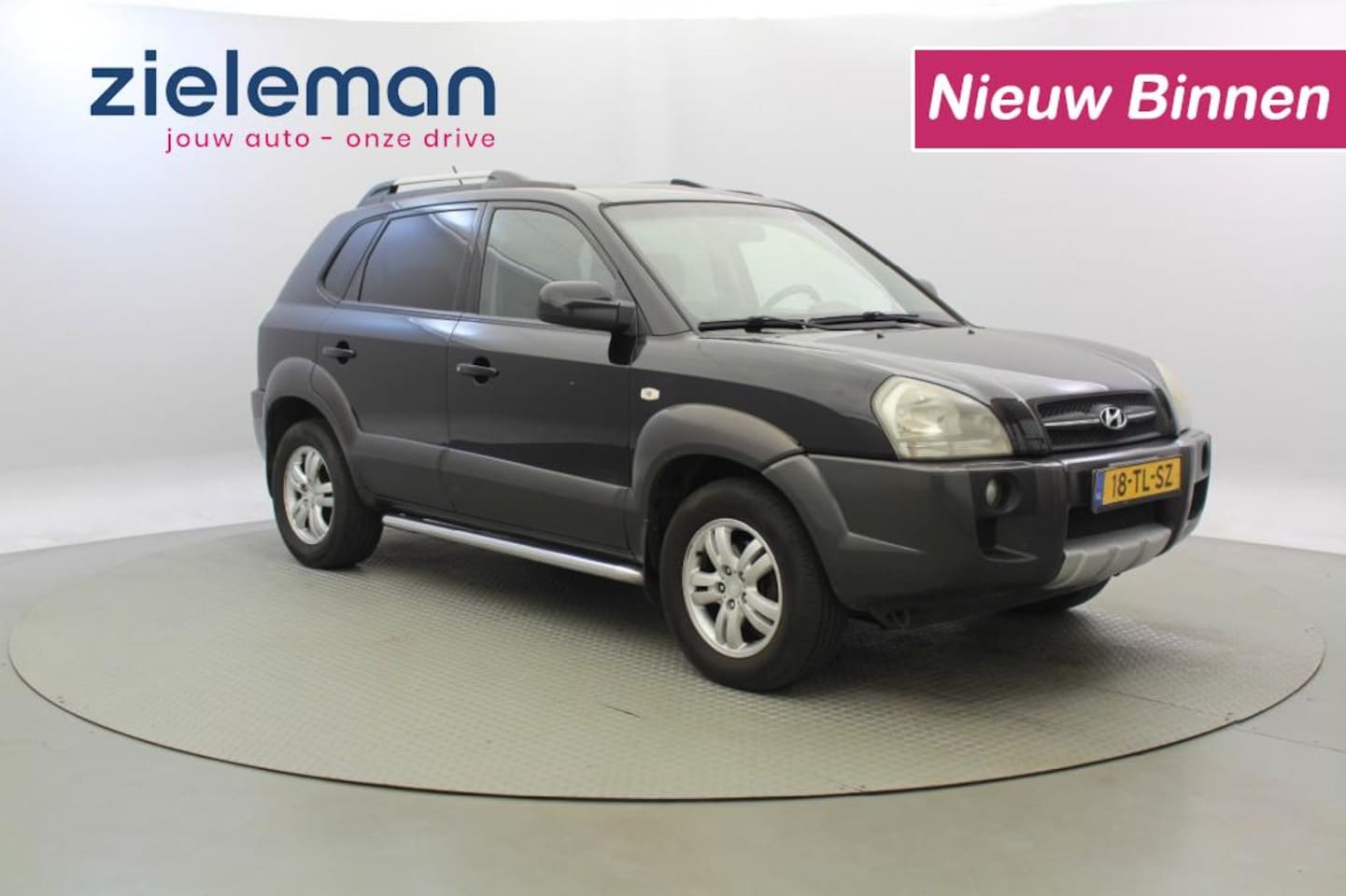 Hyundai Tucson - 2.0i Dynamic Cross - Airco, Trekhaak - AutoWereld.nl