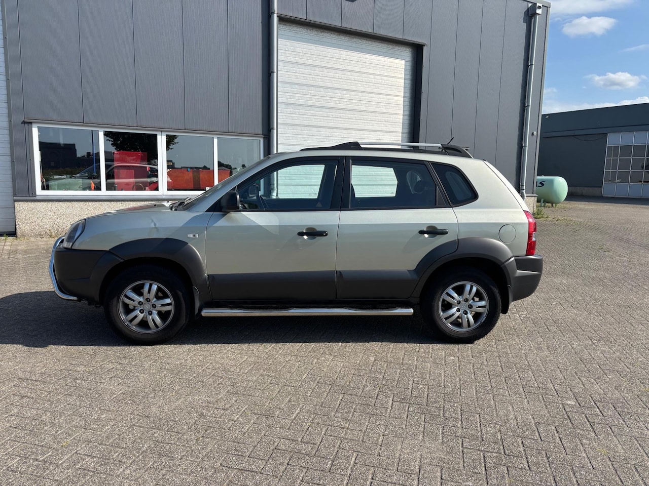 Hyundai Tucson - 2.0i Active AIRCO - AutoWereld.nl