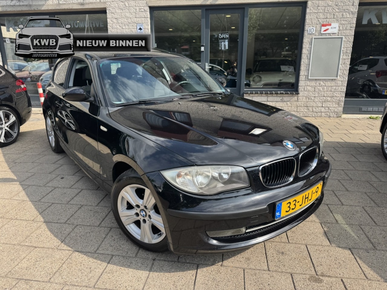 BMW 1-serie - 118i Business Schuifkanteldak Trekhaak - AutoWereld.nl