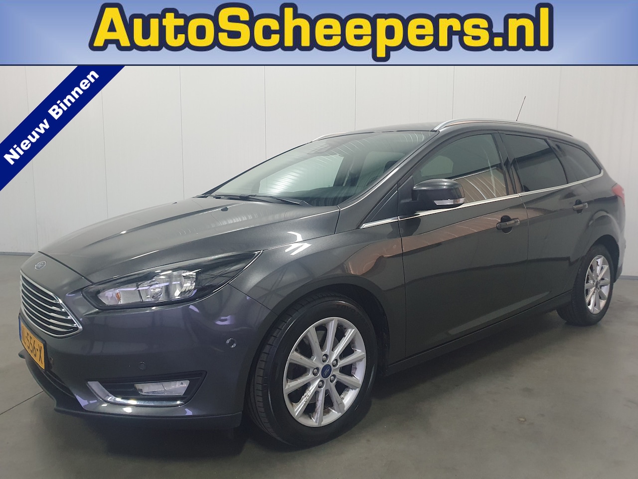 Ford Focus Wagon - 1.5 Titanium NAVI/PDC/CRUISE/TRHAAK/ST.VERW - AutoWereld.nl