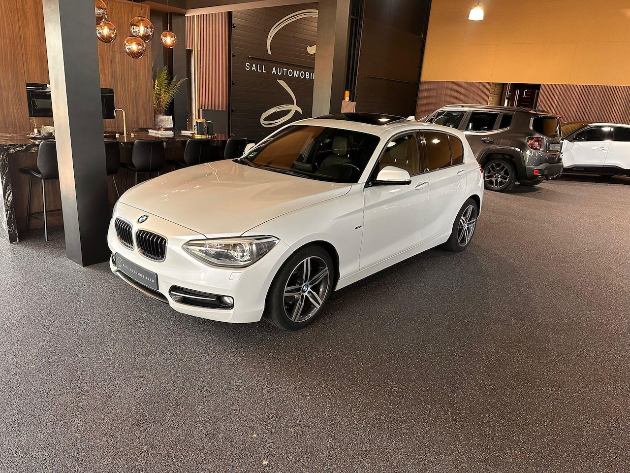 BMW 1-serie - 116i High Executive Open Dak /Leder/PDC - AutoWereld.nl