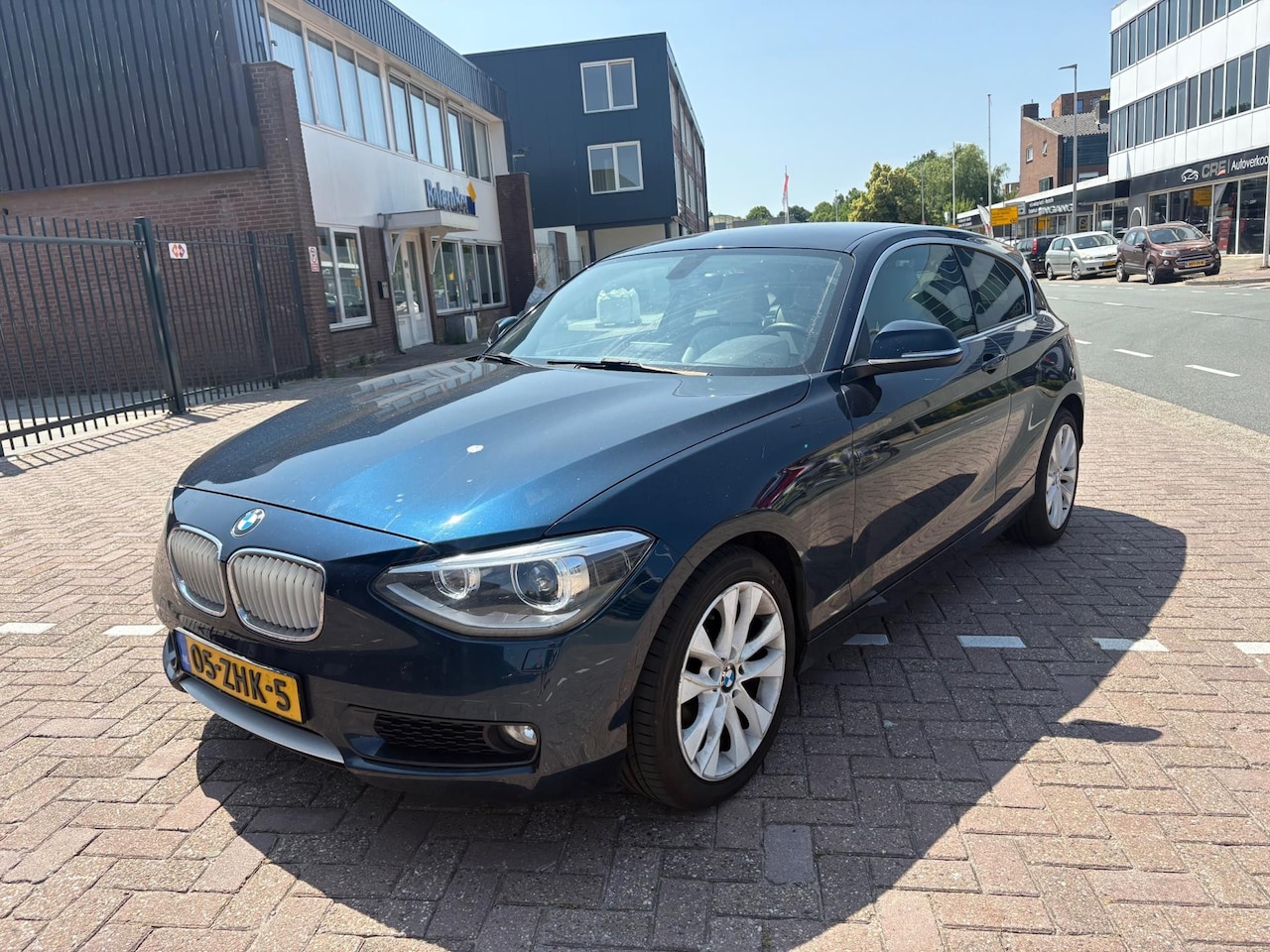 BMW 1-serie - 116i 3drs. Airco Navi Cruise Control APK NAP Leer - AutoWereld.nl