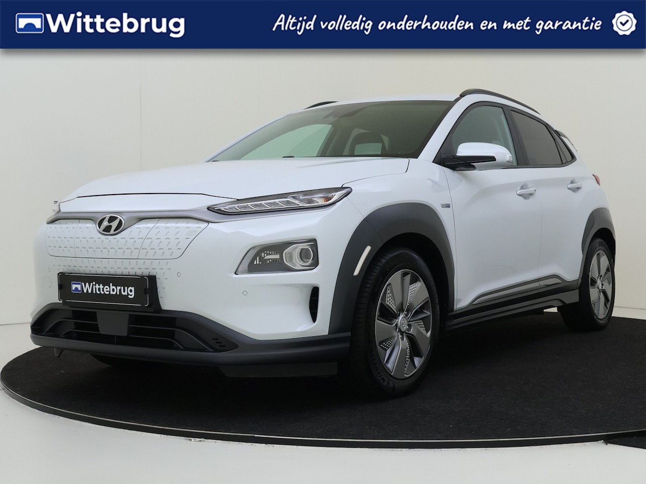 Hyundai Kona Electric - EV Premium 64 kWh Automaat | Navigatie | Trekhaak | Lederen bekleding - AutoWereld.nl