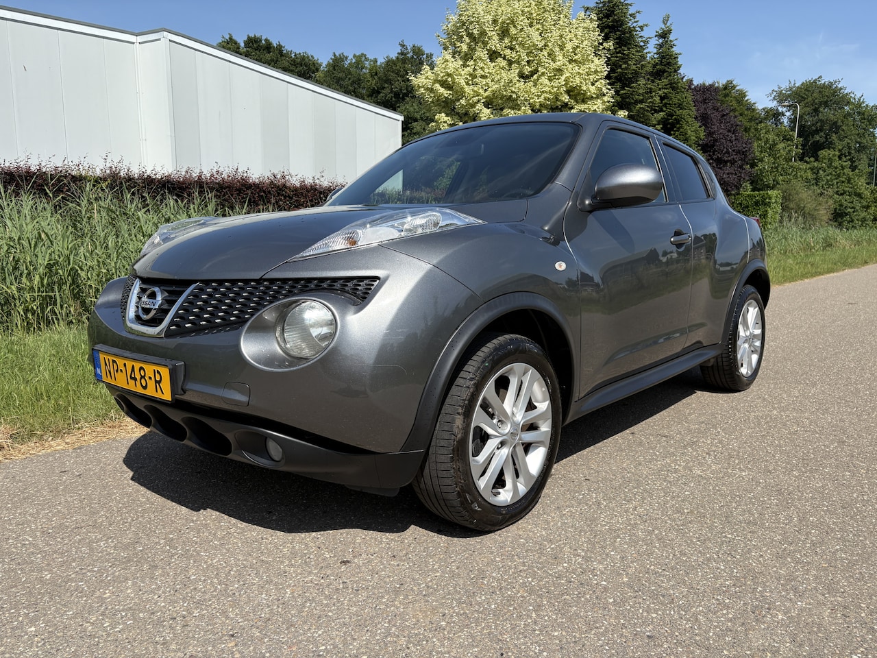 Nissan Juke - 1.6 Tekna / NAVI / LEER / CRUISE / 126dkm! - AutoWereld.nl