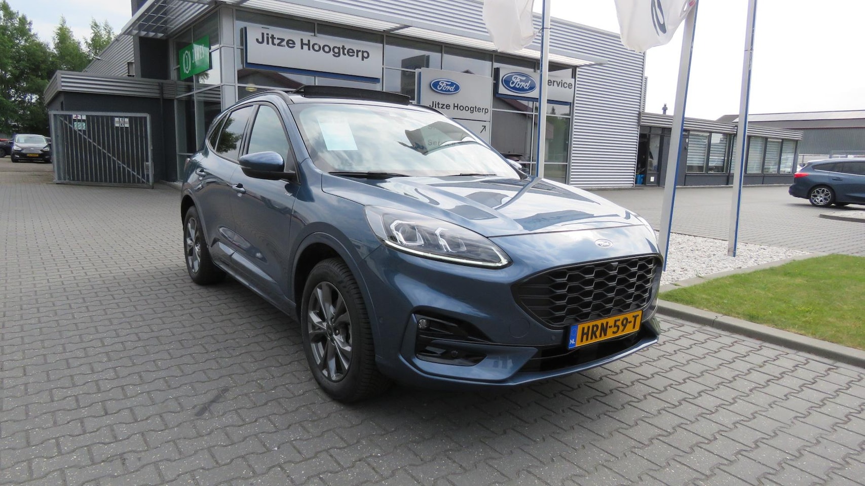 Ford Kuga - 2.5 PHEV ST-Line X PANO, ADAPTIEVE CRUISE, CLIMA, HUD, WINTER PACK, NAVI, ELEKTRISCHE ACHT - AutoWereld.nl