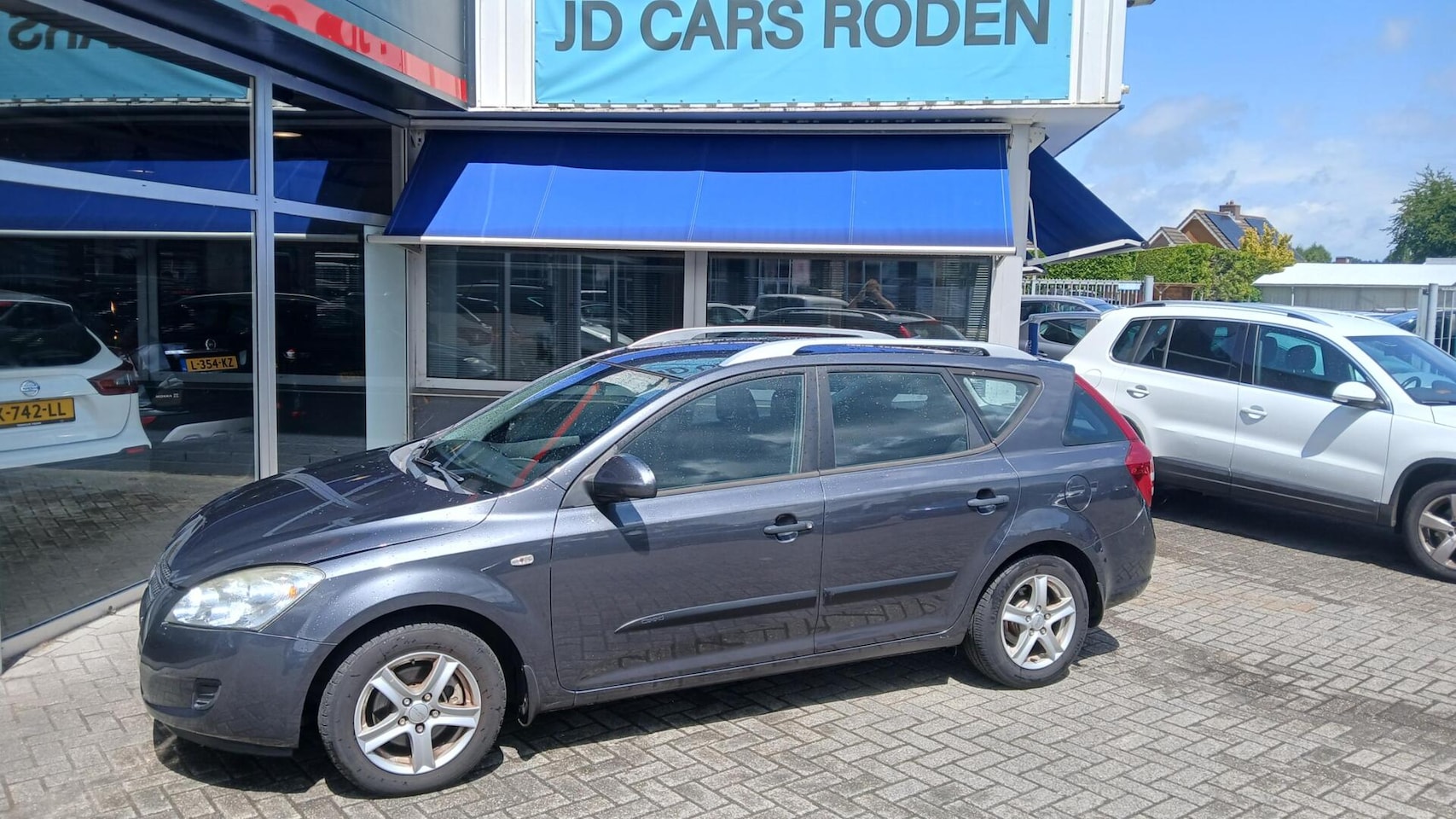 Kia Cee'd Sporty Wagon - 1.4 Fifteen! Koude AC! Export Handel! - AutoWereld.nl
