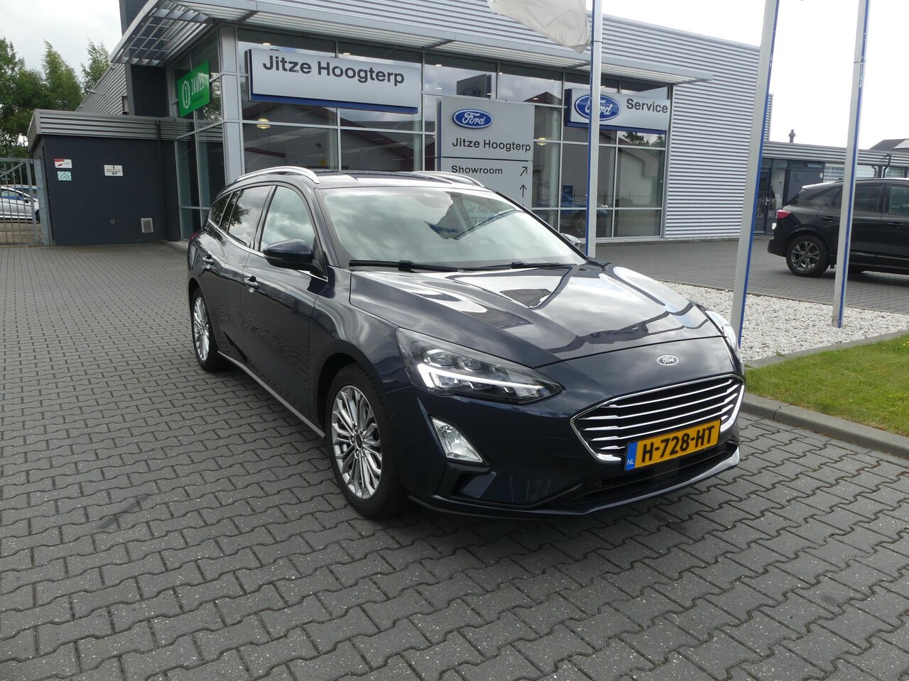 Ford Focus Wagon - 1.0 EcoBoost Titanium Business CRUISE, CLIMA, NAVI, CAMERA, WINTER PACK, PDC V&A, 80.388KM - AutoWereld.nl