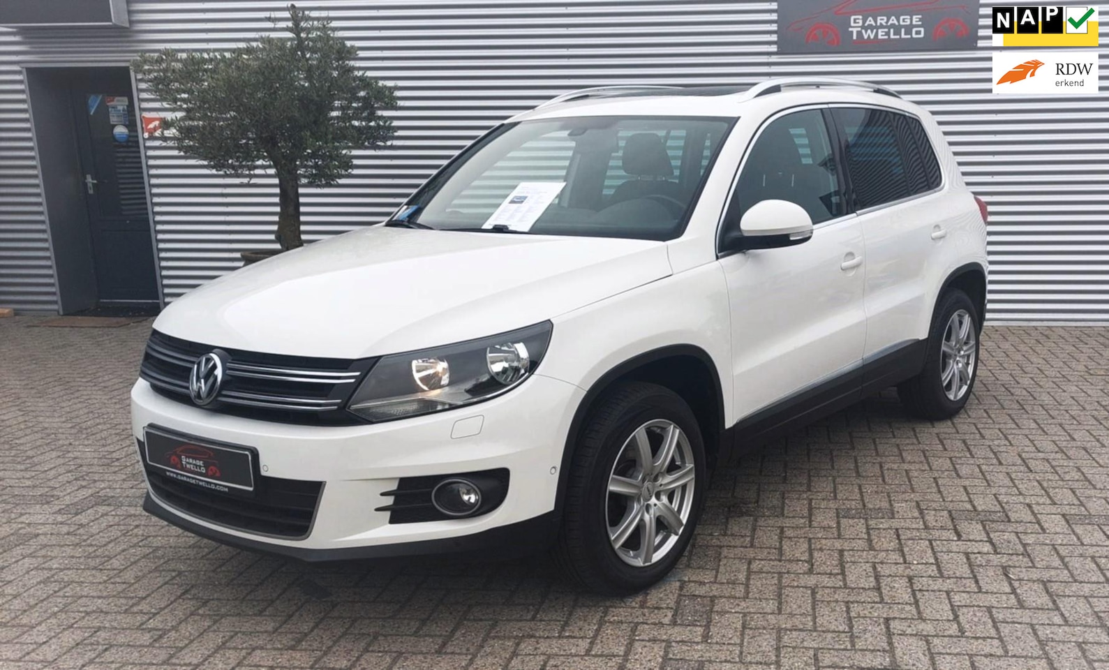 Volkswagen Tiguan - 1.4 TSI Sport&Style panoramadak, navigatie, pdc,160 pk. - AutoWereld.nl