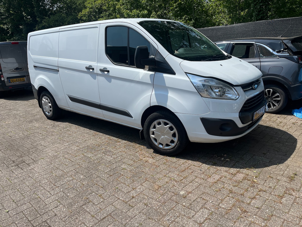 Ford Transit Custom - 340 2.0 TDCI L2H2 Ambiente motorschade. - AutoWereld.nl