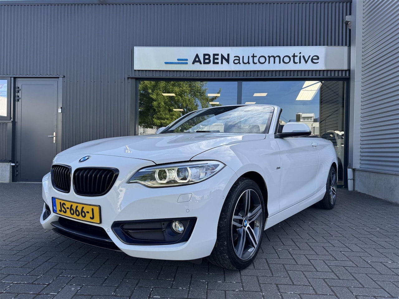 BMW 2-serie Cabrio - 218i Sport 218i Sport (CAMERA|NAVI PROF.|17"|STOELVERW.) - AutoWereld.nl