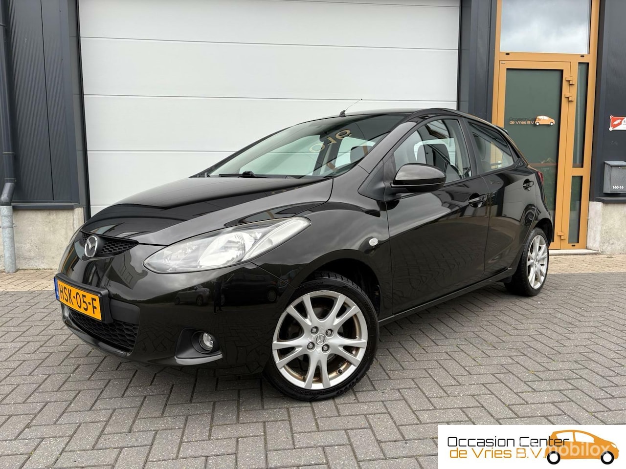 Mazda 2 - 1.3 5drsAircoVelgenElektrPakketStoelverwarmBluetooth - AutoWereld.nl