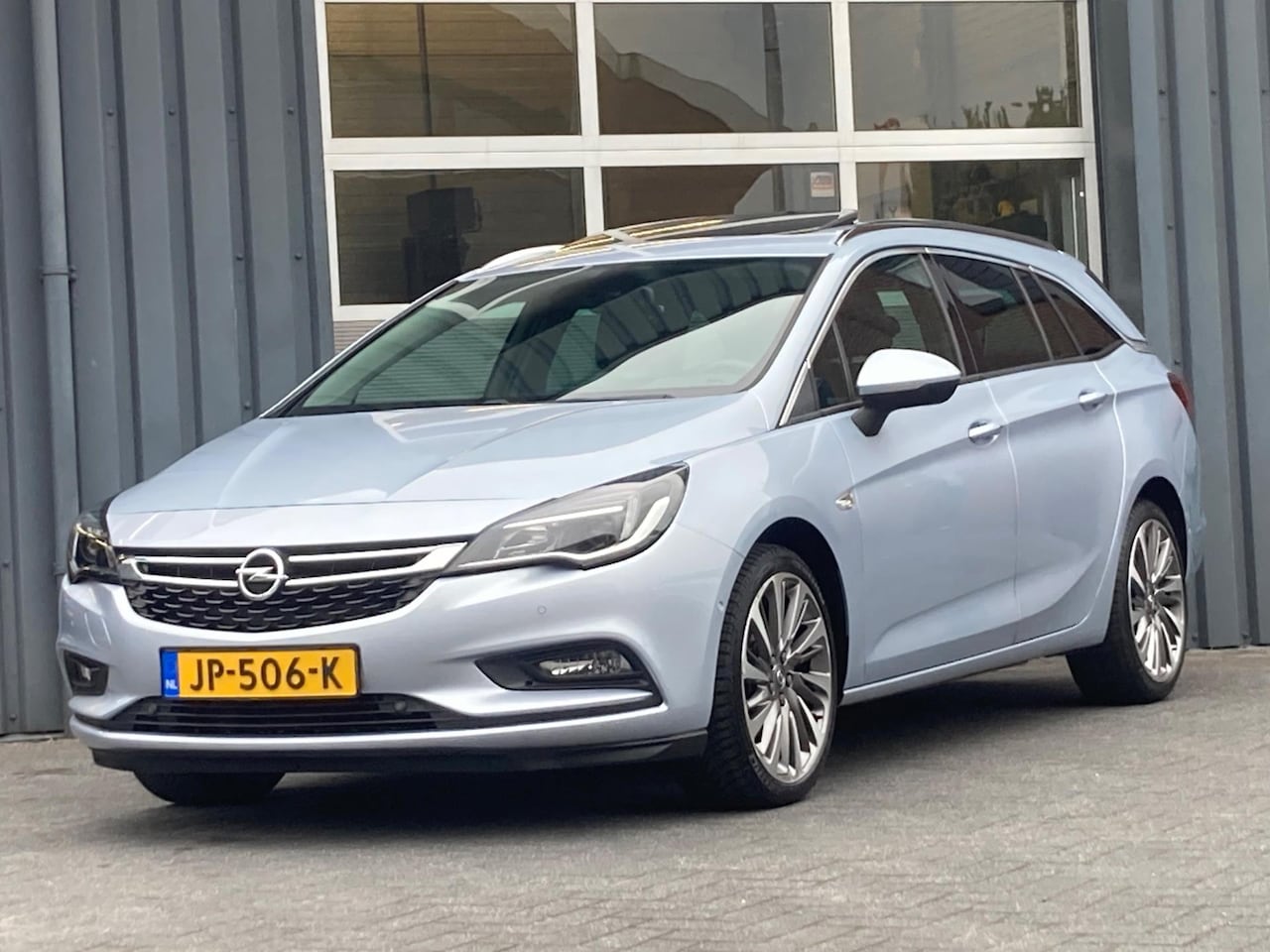 Opel Astra Sports Tourer - 1.4 Innovation Automaat Navi Cruise Pdc Dak Trekhaak - AutoWereld.nl