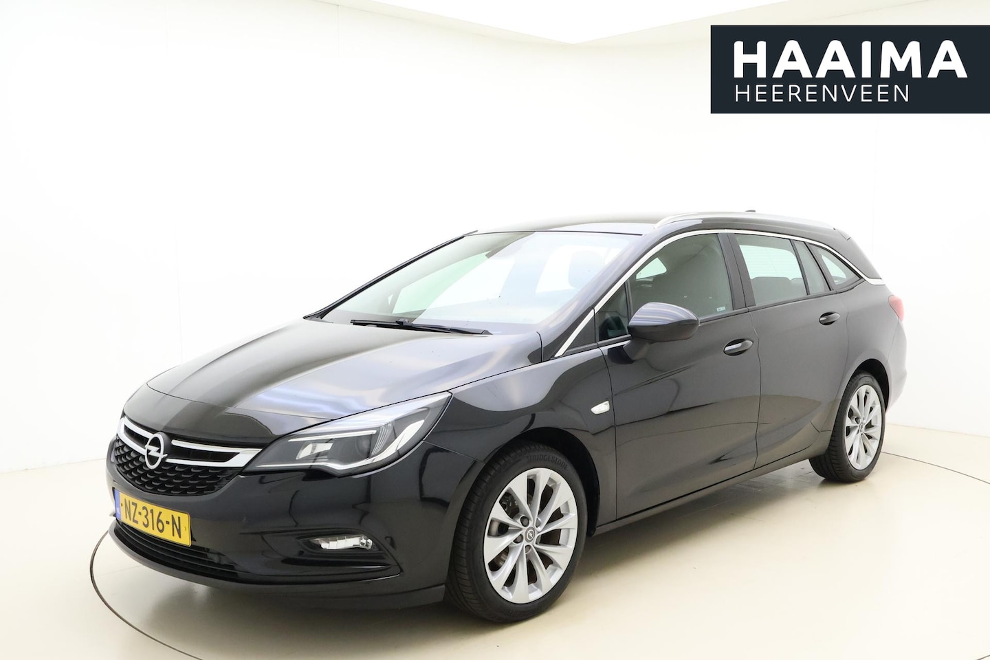 Opel Astra Sports Tourer - 1.0 Edition | Climate control | Navigatie | Trekhaak | Comfort stoelen | Weinig kilometers - AutoWereld.nl
