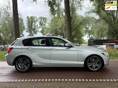BMW 1-serie - 118i Business XENONSCHUIFDAKNAVI6BAK
