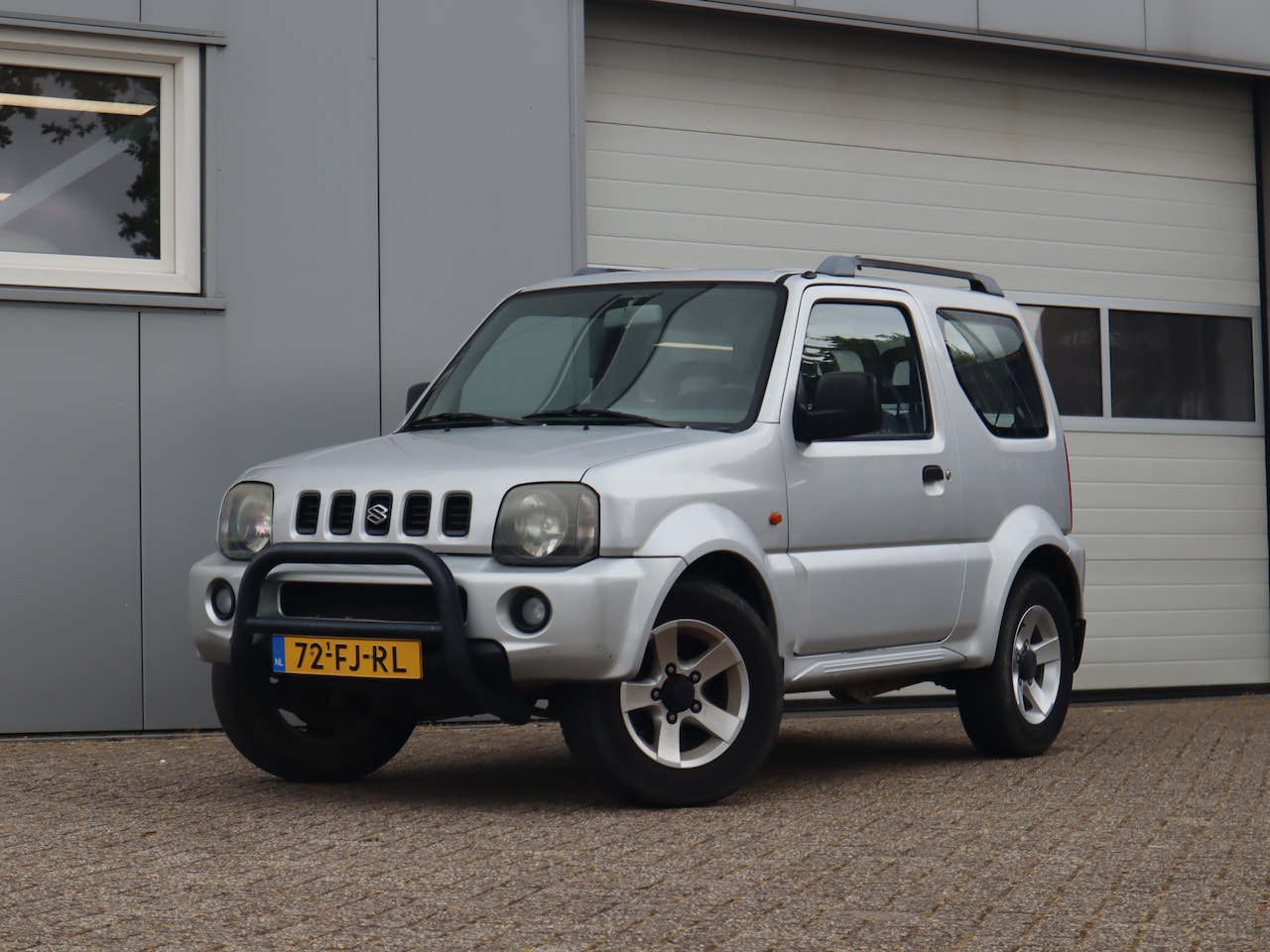 Suzuki Jimny - 1.3 JLX 4X4 / Airco - AutoWereld.nl