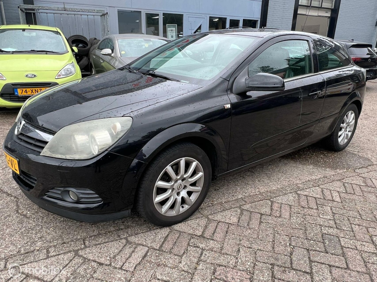 Opel Astra GTC - 1.6 Sport / Navigatie/ Airco - AutoWereld.nl