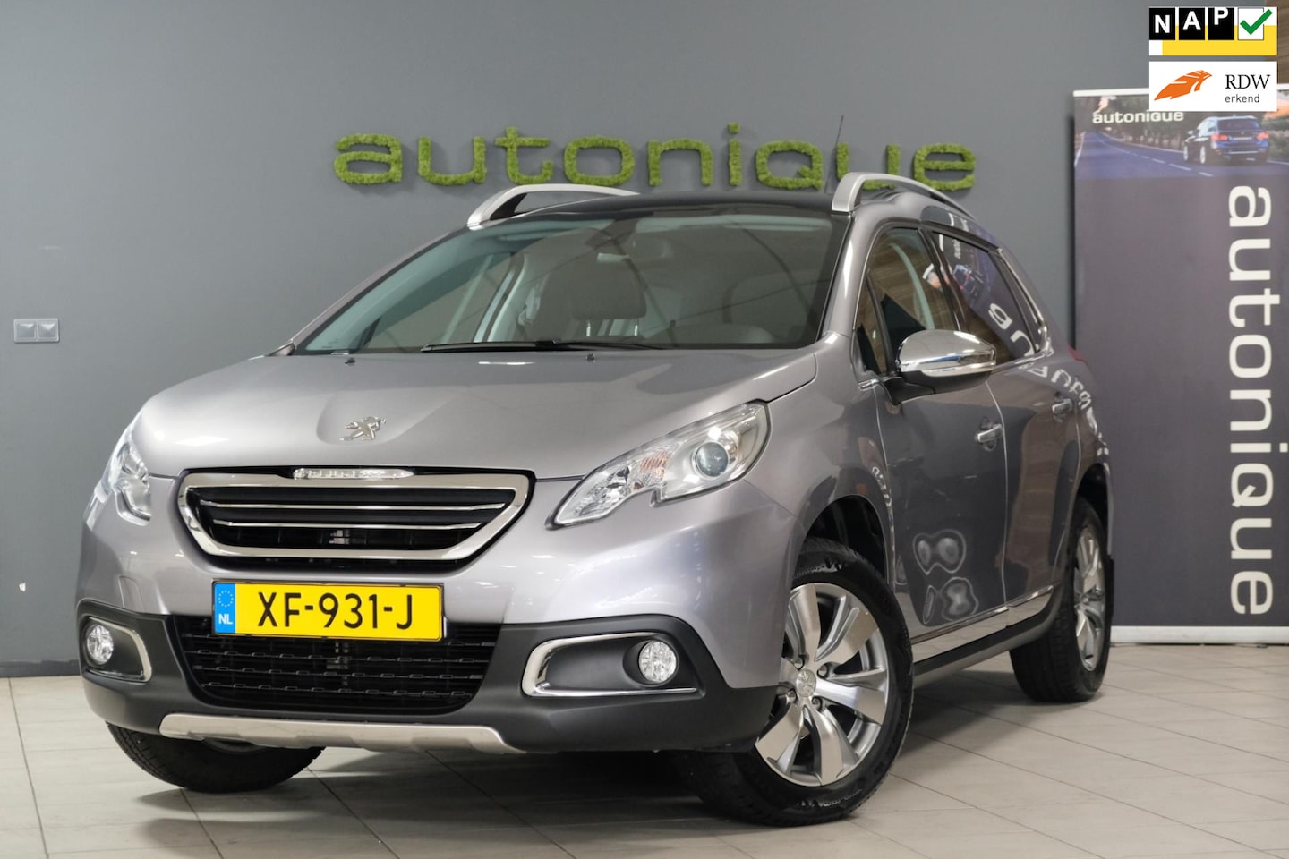 Peugeot 2008 - 1.2 VTi Allure Pack PANODAK|Trekhaak|Navi|All-Season Banden LUXE UITV. - AutoWereld.nl