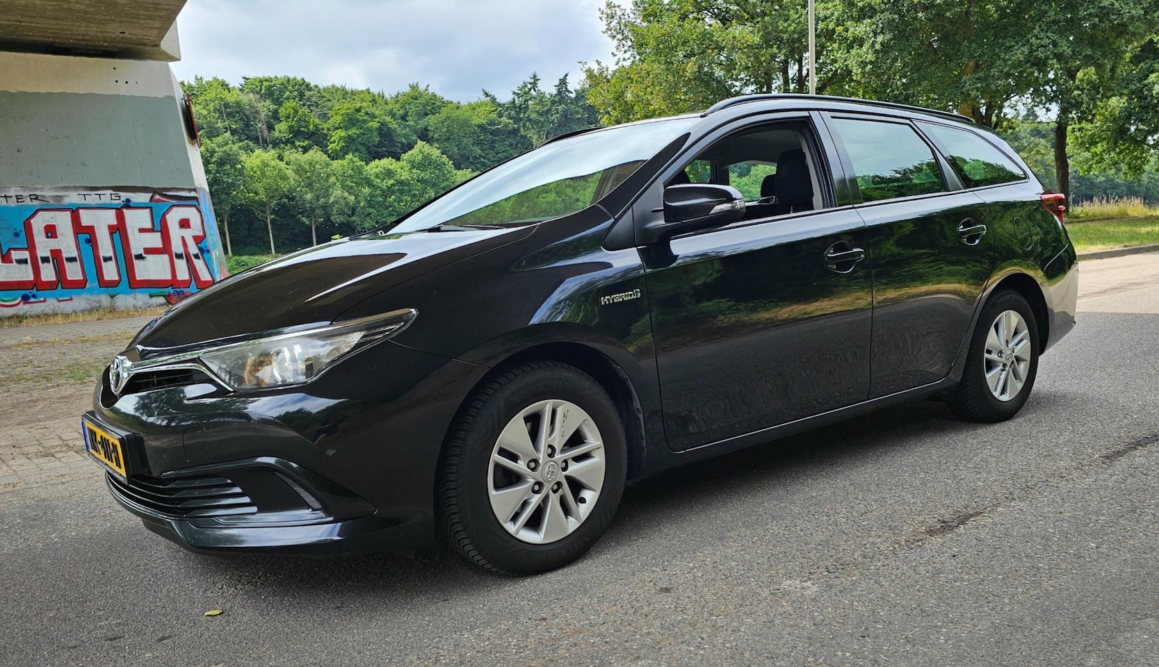 Toyota Auris Touring Sports - 1.8 Hybrid Business 1e Eigenaar - AutoWereld.nl