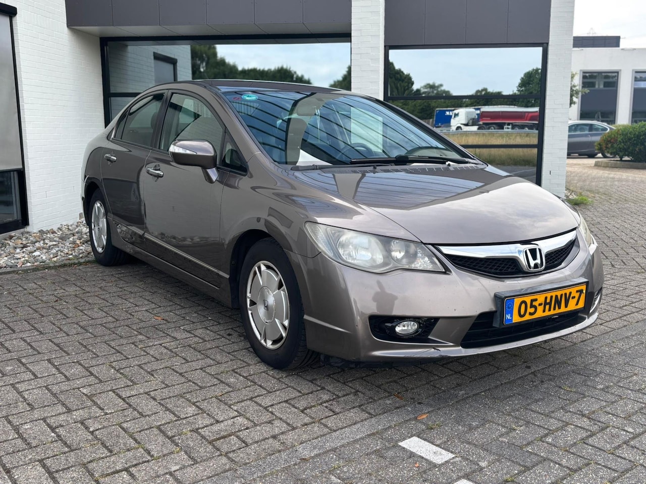 Honda Civic - 1.3 Hybrid NWE APK/AIRCO/ELECT RAMEN/LEDER/STOELVERW/NAVI - AutoWereld.nl