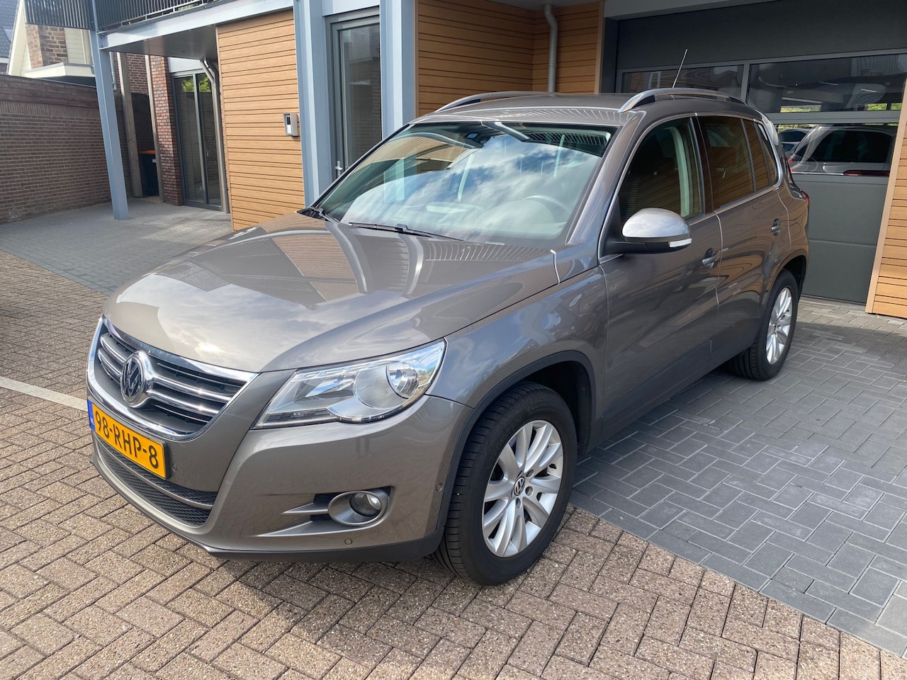 Volkswagen Tiguan - 1.4 TSI Sport&Style | Navi | Camera | Cruise - AutoWereld.nl