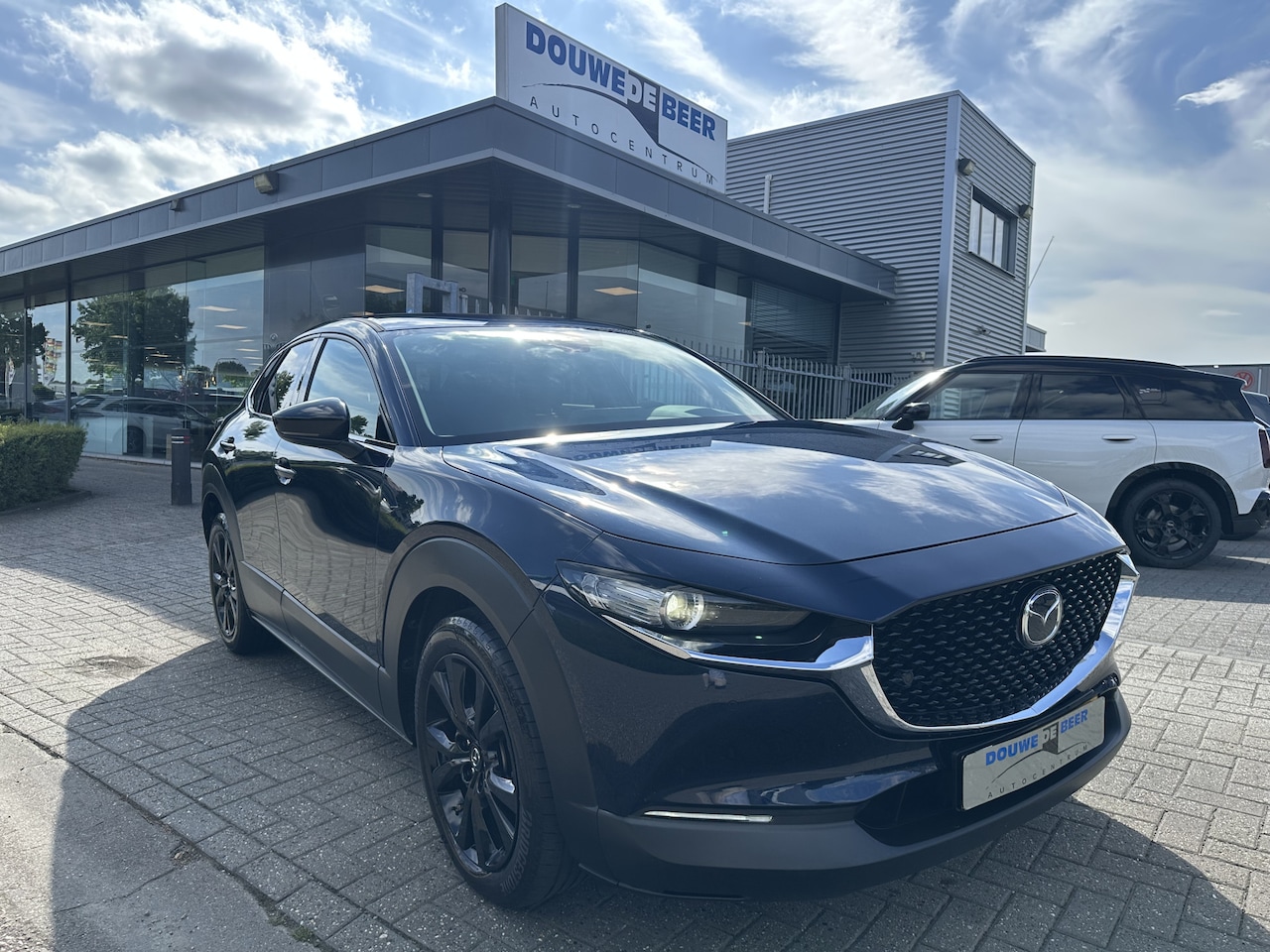 Mazda CX-30 - 2.0 e-SkyActiv-G M Hybrid Homura Trekhaak | Camera | Adapt. Cruise | Carplay - AutoWereld.nl