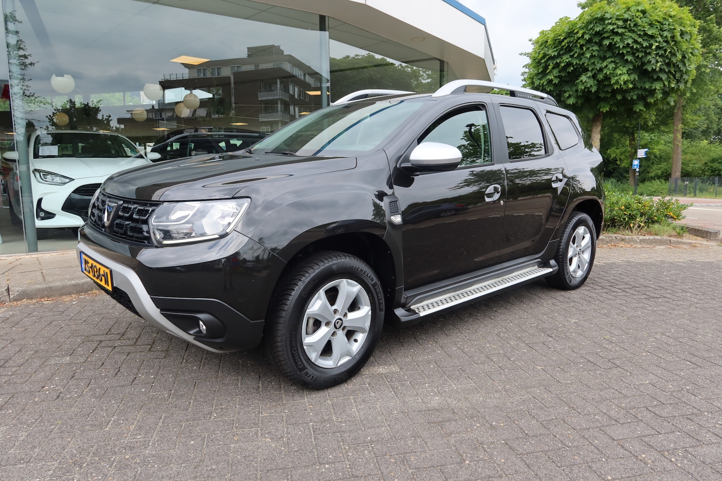 Dacia Duster - 1.2 TCe Comfort 125PK 4x2 All-Season I Trekhaak - AutoWereld.nl