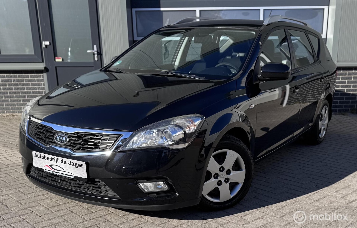 Kia Cee'd Sporty Wagon - 1.4 CVVT X-ecutive 1.4 CVVT X-ecutive - AutoWereld.nl