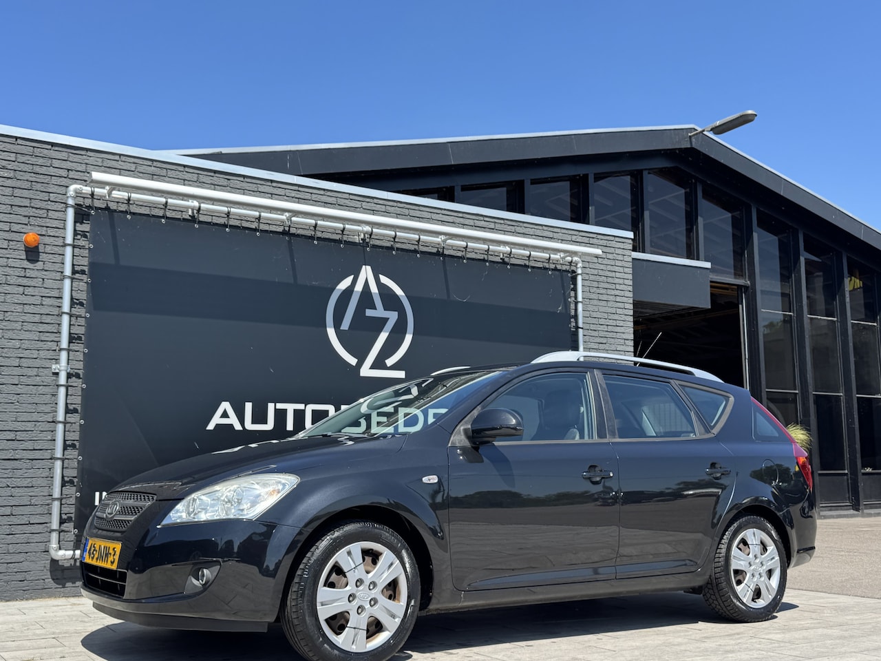 Kia Cee'd Sporty Wagon - 1.4 CVVT X-ecutive 1.4 CVVT X-ecutive - AutoWereld.nl