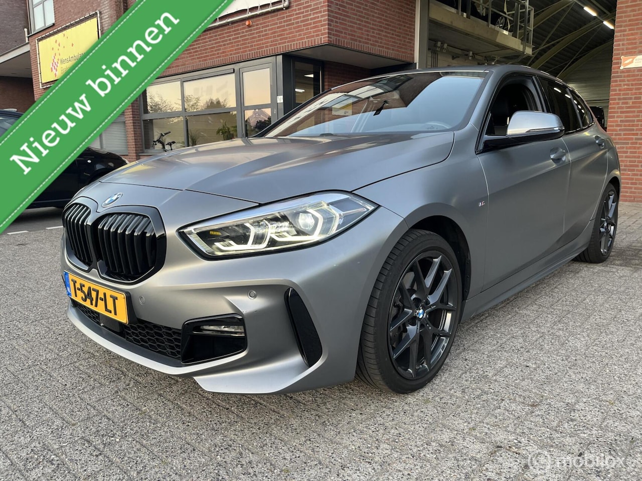 BMW 1-serie - 118i EDE M-PAKKET*LED*NAVI*SFEER*FROZEN-GREY* - AutoWereld.nl