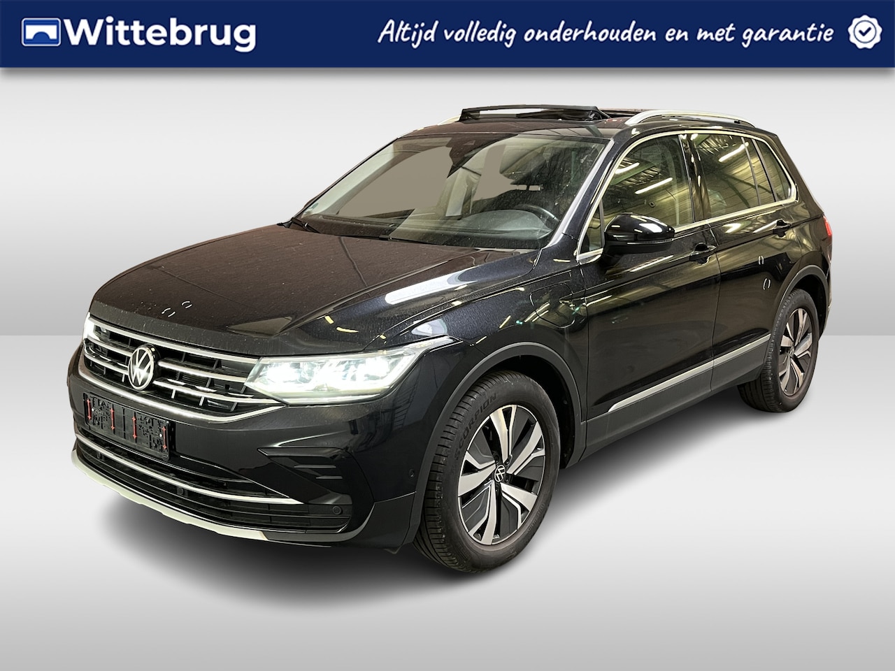 Volkswagen Tiguan - 1.4 TSI eHybrid Elegance / AUTOMAAT/ ELEKTR. TREKHAAK/ PANO/ STOELVERWARM. V+A/ PARK. SENS - AutoWereld.nl
