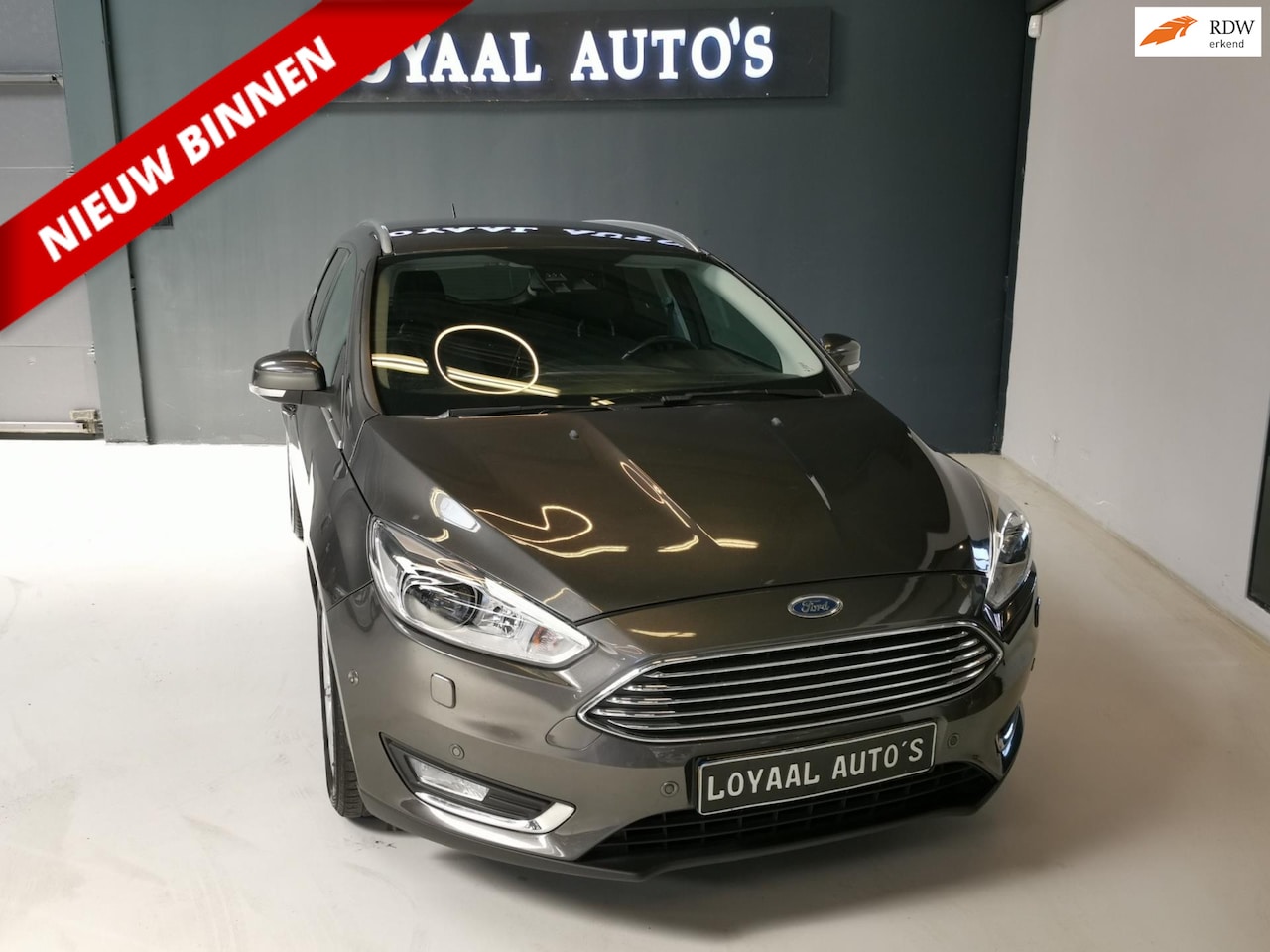Ford Focus Wagon - 1.0 First Edition | NAVI | AIRCO | CRUISE | STOEL.VERW | PDC | APK. - AutoWereld.nl