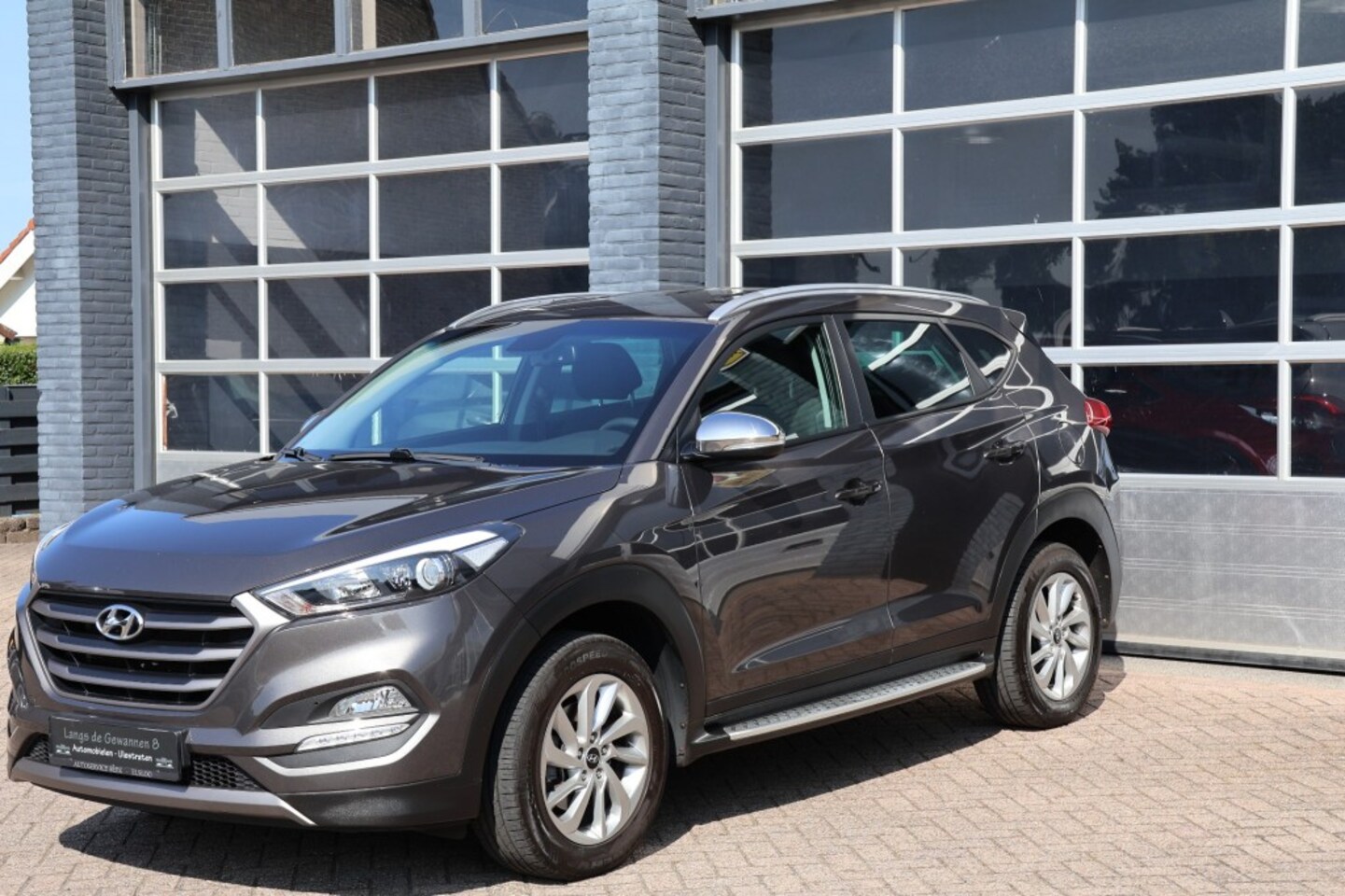 Hyundai Tucson - 1.6 GDi comfort navigatie, camera - AutoWereld.nl