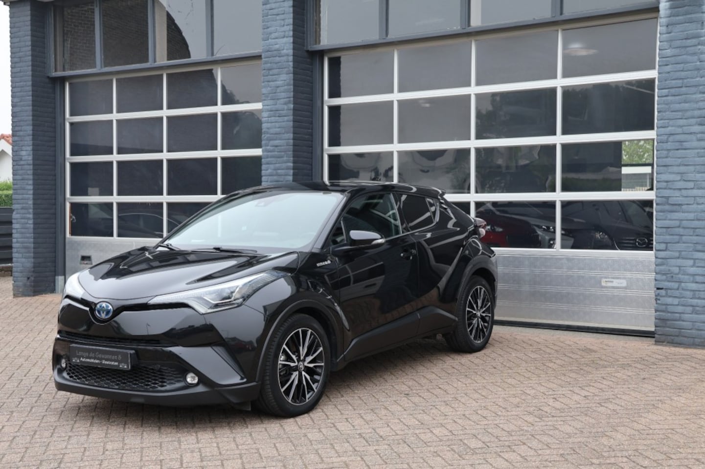 Toyota C-HR - 1.8 Hybride executive, leder, navigatie, camera - AutoWereld.nl