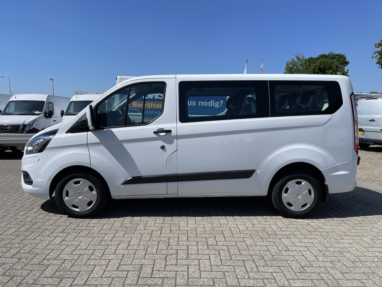Ford Transit Custom - 320 1.0 EcoBoost hybride / L1H1 PHEV Trend 9 persoons / € 38.950 incl btw bpm / lease vana - AutoWereld.nl