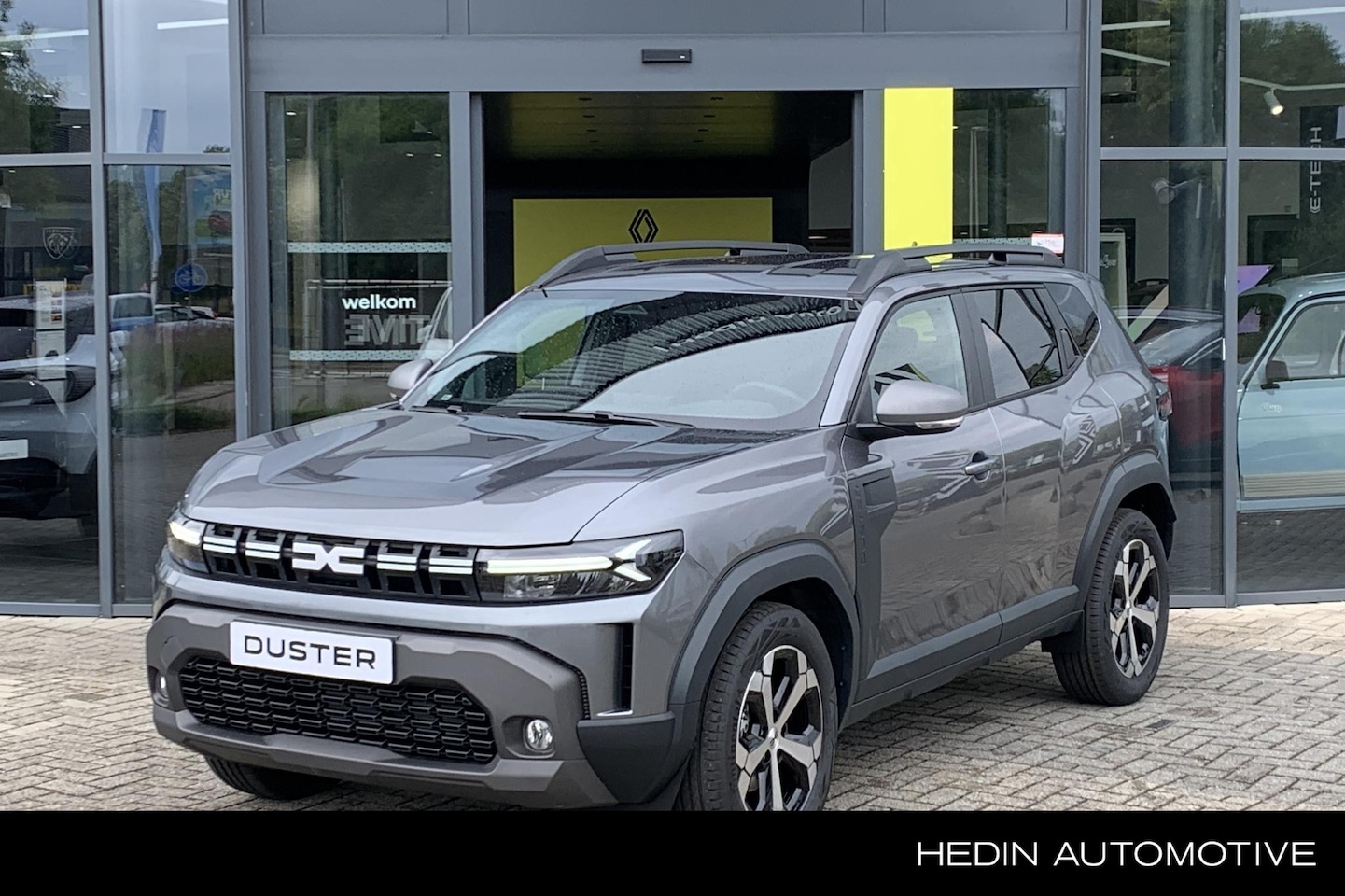 Dacia Duster - 1.6 Hybrid 140 Journey | Pack winter | Climate control | Navigatie | Keyless | Apple carpl - AutoWereld.nl