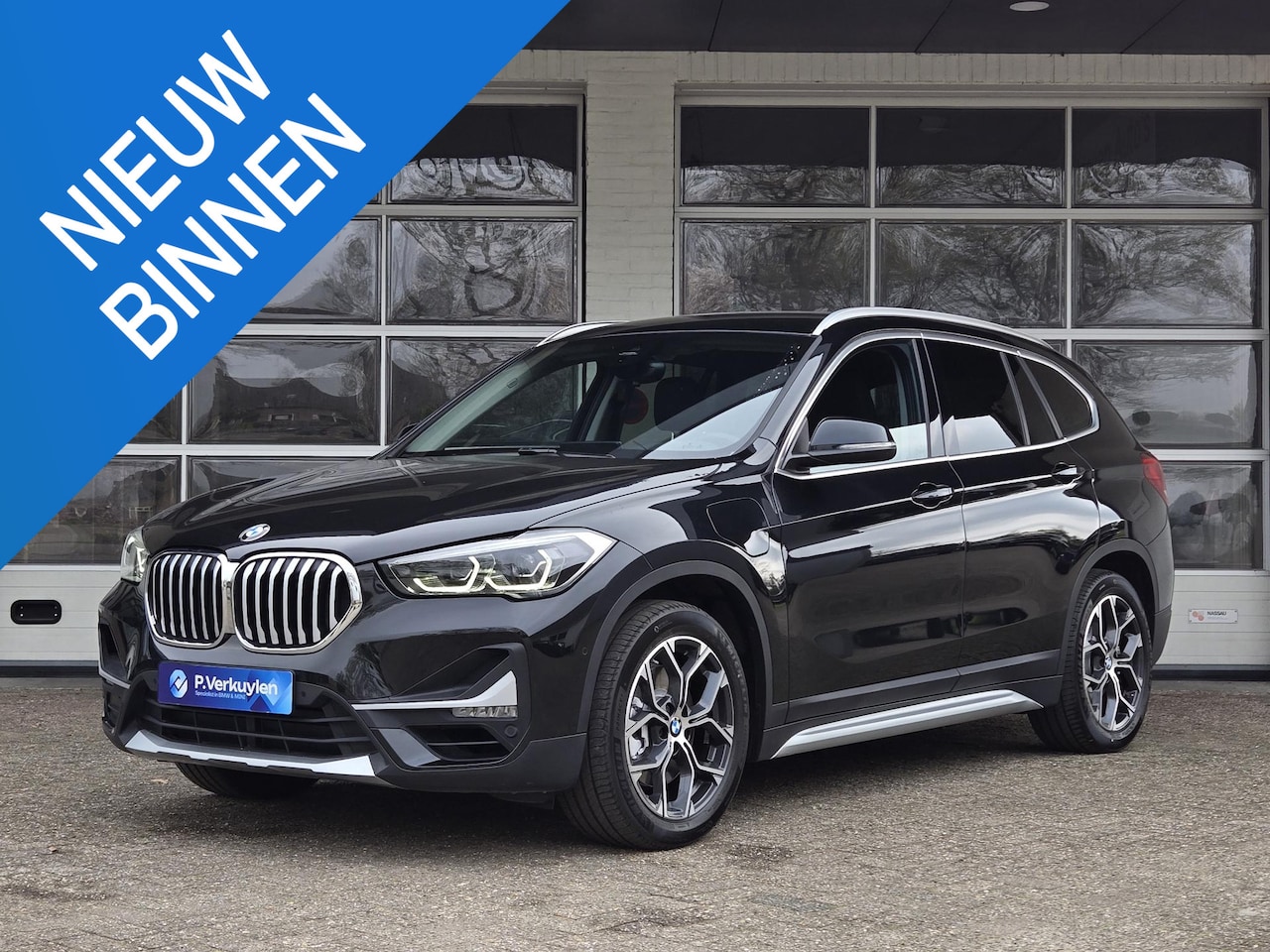BMW X1 - xDrive25e X Line | SPORTSTOELEN | NAVIGATIE PLUS | CAMERA | TREKHAAK | STOELVERWARMING - AutoWereld.nl