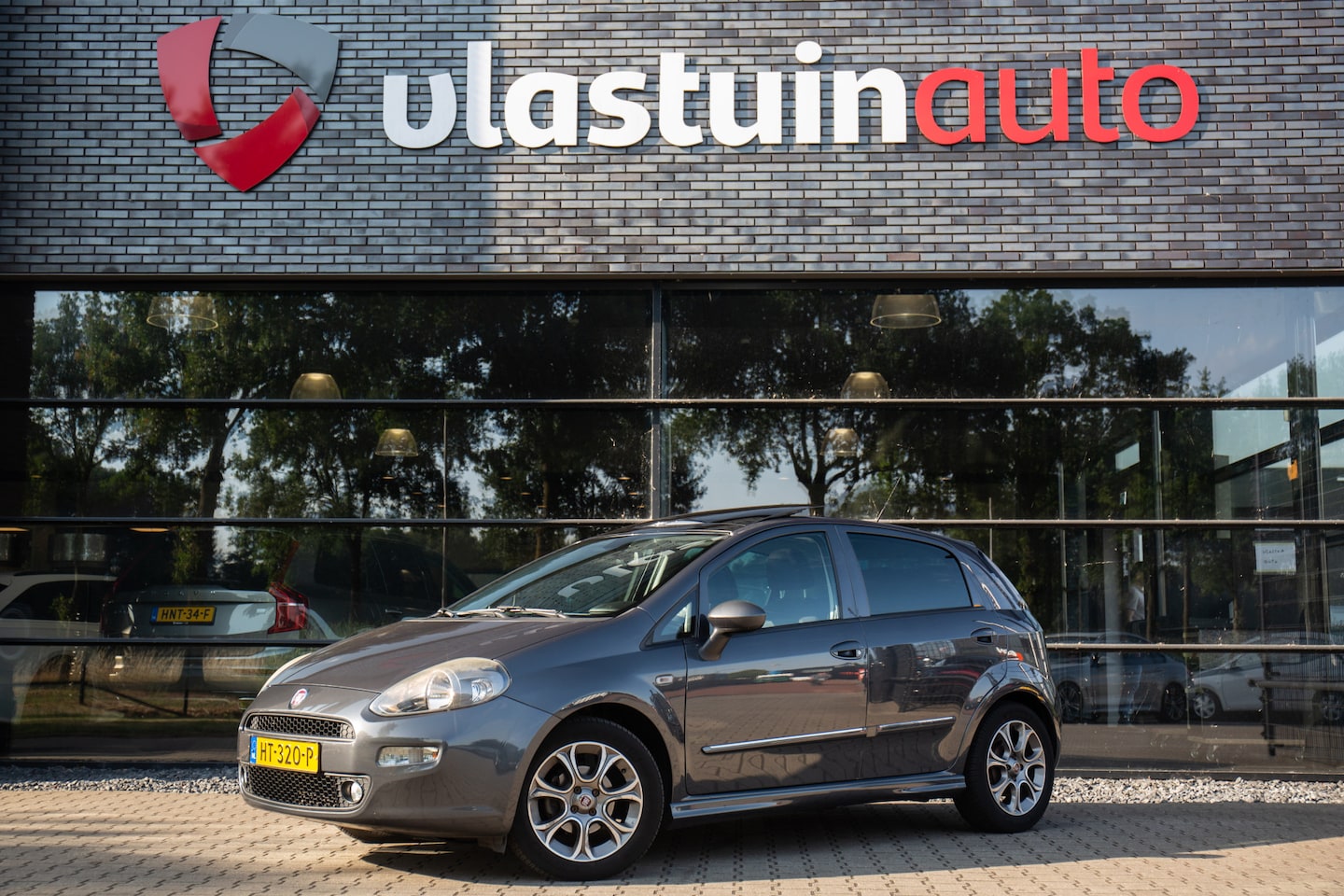 Fiat Punto Evo - 1.3 M-Jet Lounge 1.3 M-Jet Lounge , Pano, 5-deurs, Airco, Cruise - AutoWereld.nl