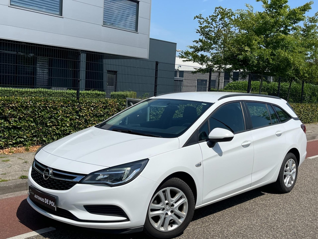 Opel Astra Sports Tourer - 1.4 Business Executive Airco Cruise/Control Pakeersensor - AutoWereld.nl