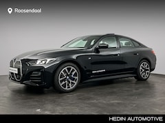 BMW i4 - eDrive35 M Sport Edition 70 kWh | Trekhaak | Open dak | Camera | Verwarmd stuurwiel | Hi-F
