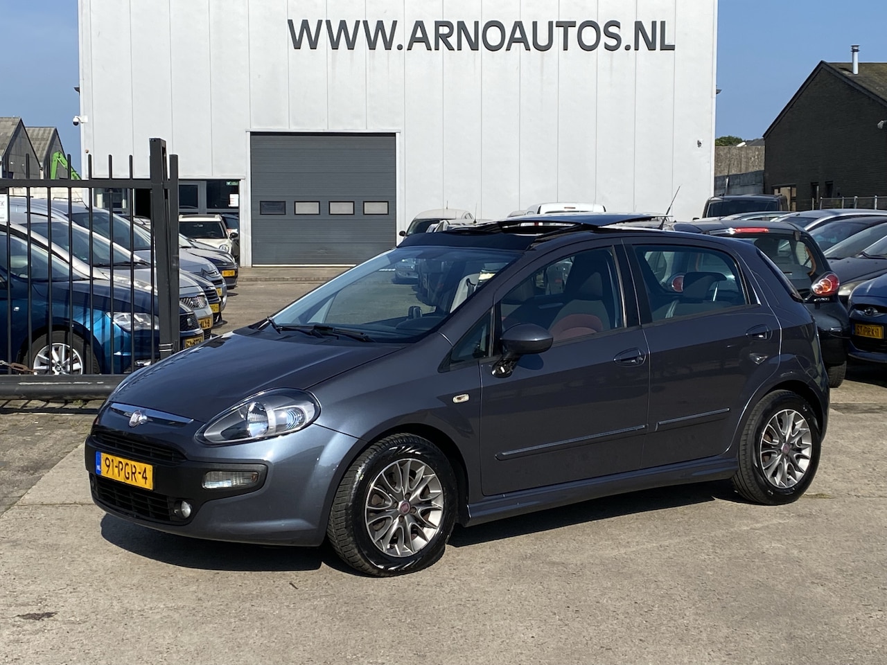 Fiat Punto Evo - 1.3 M-Jet Dynamic EURO 5, 5-DEURS, AIRCO(CLIMA), CRUISE CONTROL, ELEK-PANORAMADAK, NAVIGAT - AutoWereld.nl