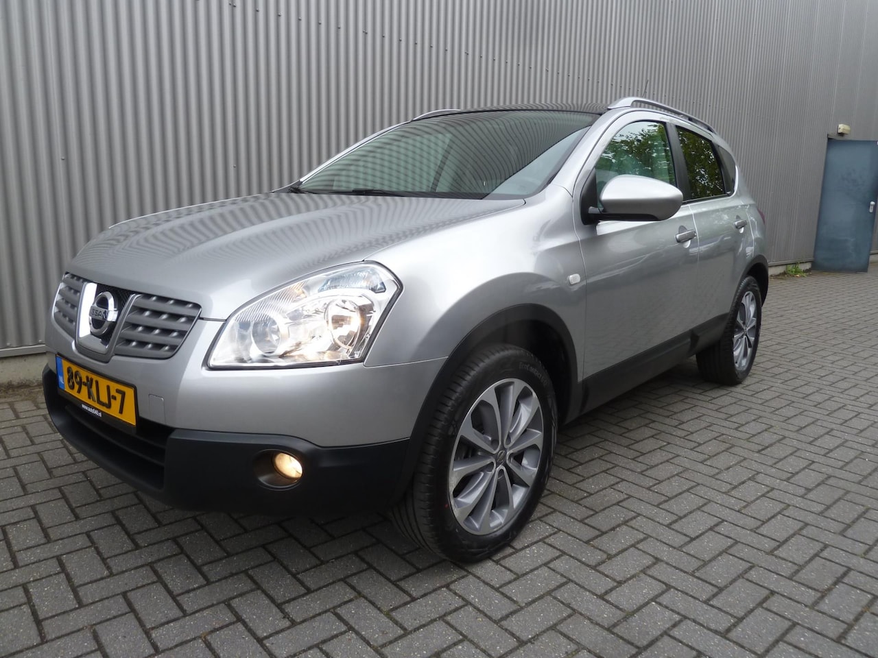 Nissan Qashqai - 2.0 Connect Edition Pano|Navi|Camera|Trekhaak - AutoWereld.nl