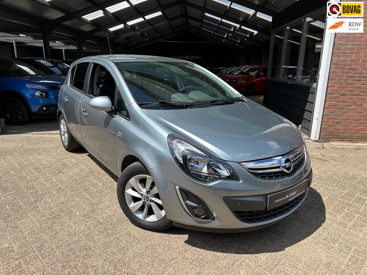 Opel Corsa - 1.2-16V Design Edition|CRUISE/TRHK/NAVI/VOLL - AutoWereld.nl