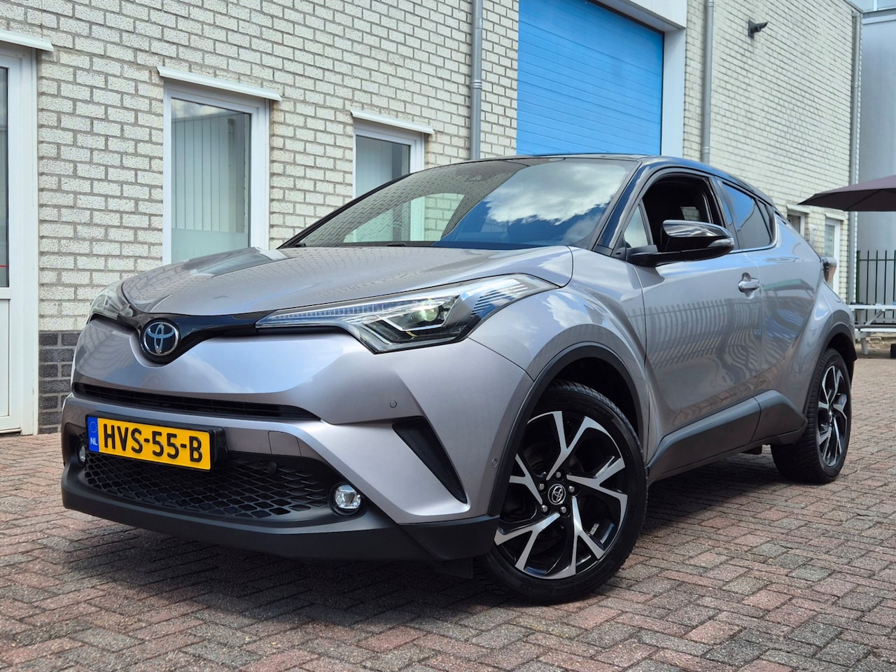 Toyota C-HR - 1.2 Bi-Tone Airco-Leer-Navi-Led-JBL Audio-Keyles - AutoWereld.nl