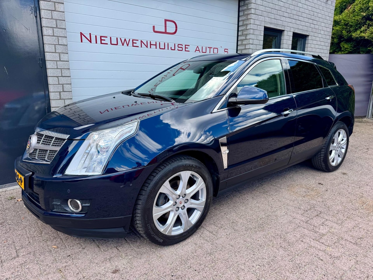 Cadillac SRX - 3.0 V6 AWD Sports Luxury 3.0 V6 AWD Sports Luxury, 1e eigenaar, EU-model, 77.526km! - AutoWereld.nl