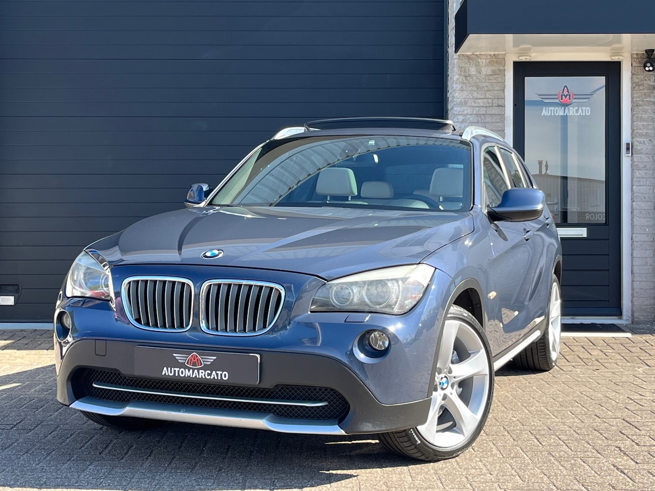 BMW X1 - XDrive28i High Executive | Aut. | Panorama dak | Leder | Sportstoelen | Xenon | Navi | 19 - AutoWereld.nl