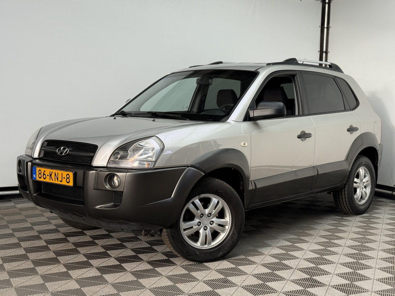 Hyundai Tucson - 2.0i Dynamic Airco Cruise Trekhaak NL Auto - AutoWereld.nl